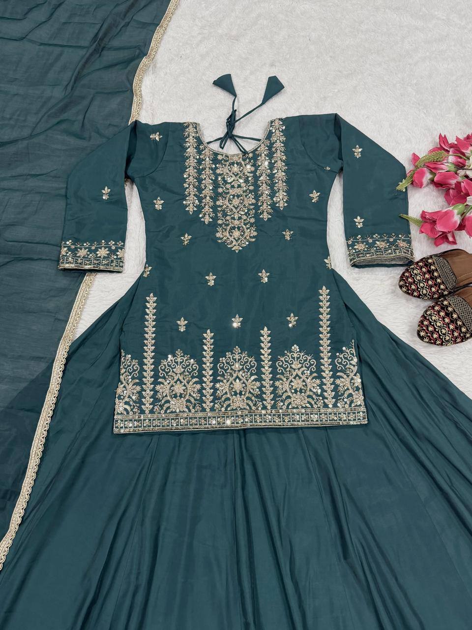 Exquisite Rama Green Peplum Kurti and Flared Skirt Set Adorned with Intricate Gold Zari Embroidery and a Matching Sheer Dupatta